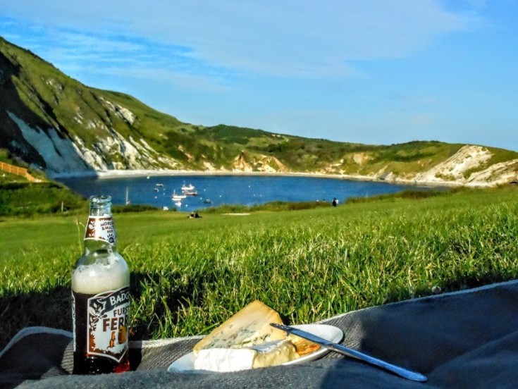 View of Lulwroth Cove, with a picnic in the foreground